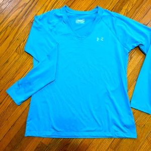 Women’s Under Armour long sleeved HeatGear workout top. Bright blue. Size Large.